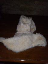 A white fur hat and collar